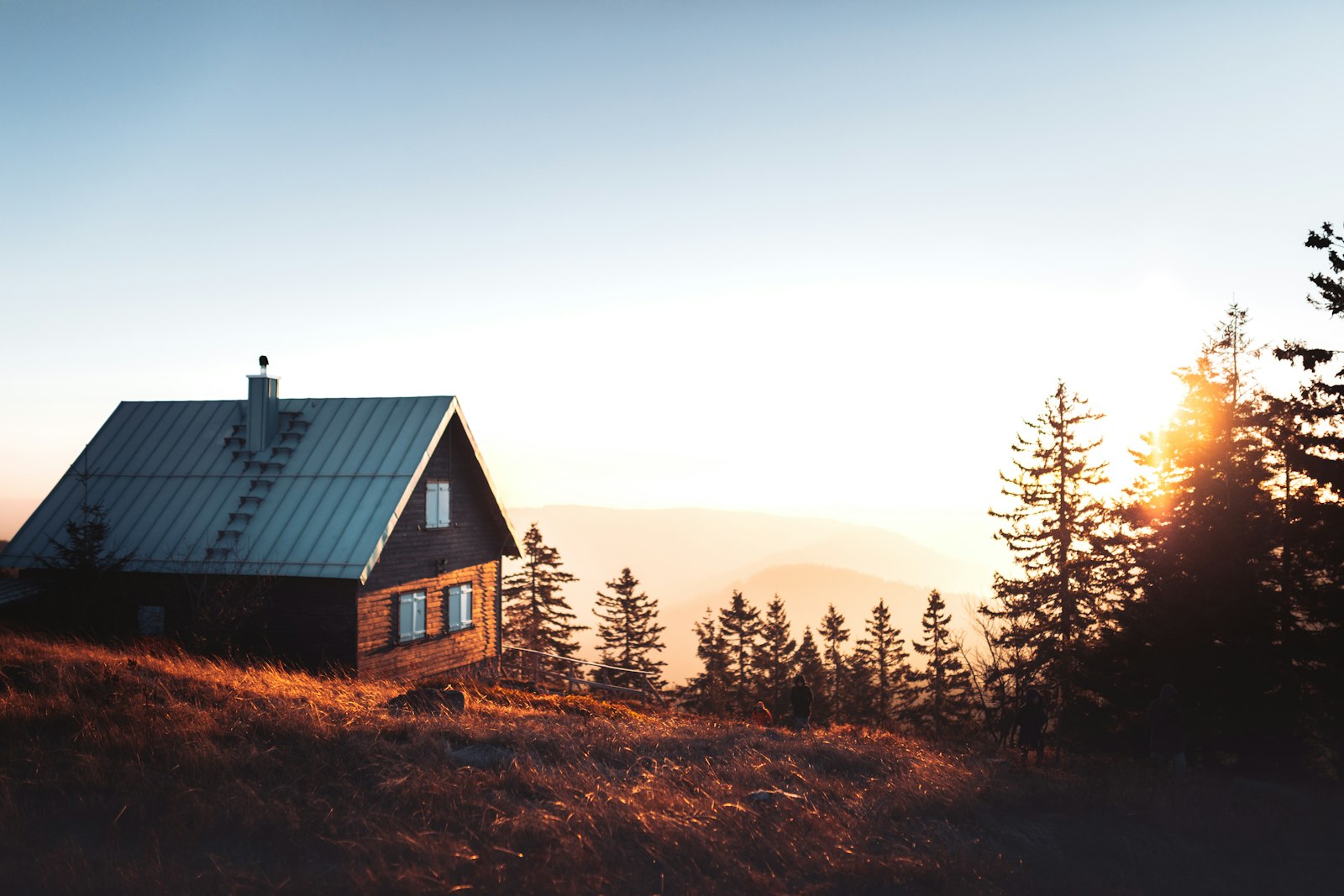 A cabin on open heathland in low evening light